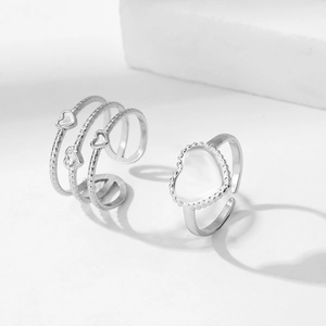 Adjustable silver heart ring set featuring wavy band and white shell inlay on white blocks