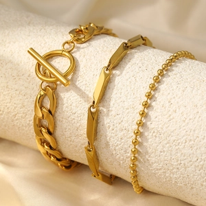 Three-piece gold stainless steel bracelet set with toggle clasp and curb chains