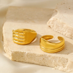 Close-up of 18K gold plated stainless steel irregular hug and wide band rings