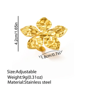 Detail of 18K gold plated stainless steel ring with hammered texture and petal shape