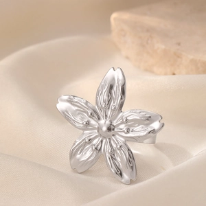 Exquisite silver cherry blossom open ring with textured petals on silk and stone background
