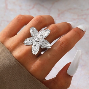 Macro detail of French vintage style flower ring featuring textured petals and a matte finish