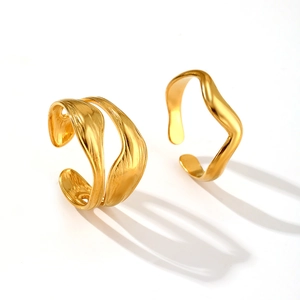 Adjustable golden wavy rings set with minimalist organic design on white background