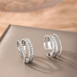 Three-layer silver stainless steel braided open ring with textured bead details