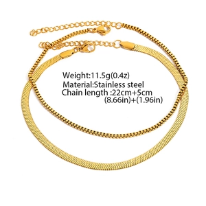 Close-up of gold stainless steel herringbone and box chain set with 22+5cm length