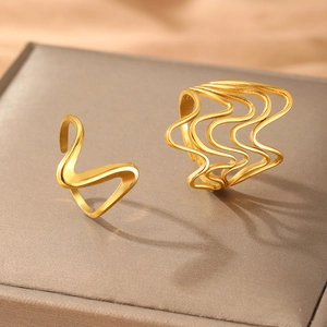 Minimalist irregular wave gold ring set with satin polished finish on jewelry box
