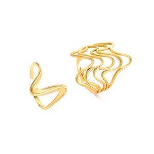 Minimalist gold irregular wave line ring set with fluid hollow design on white background