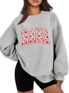 Detail of red heart patterns inside MAMA text on a thick grey oversized sweatshirt