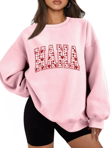 Detail of pink MAMA sweatshirt with red heart patterns and high quality soft fabric texture