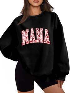 Close-up of MAMA text print with red and pink heart patterns on black sweatshirt