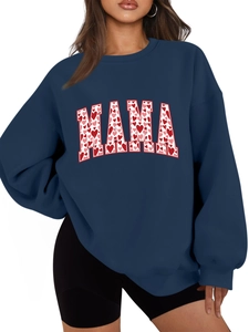 Detail of navy blue sweatshirt featuring MAMA lettering with red heart pattern print
