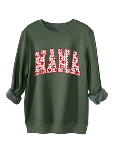 Detail of dark green sweatshirt featuring MAMA lettering with red heart pattern print