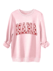 Detail of pink Mama sweatshirt featuring red heart pattern lettering and ribbed cuffs