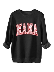Detail of MAMA lettering with red and pink heart patterns on black sweatshirt