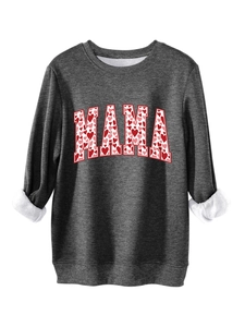 Close-up of MAMA sweatshirt featuring pink heart prints and warm fleece lining