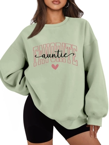 Detail of mint green pullover sweatshirt featuring pink Favorite Auntie heart graphics