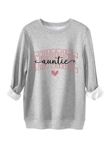 Detail of the cozy grey sweatshirt featuring soft faux fur trim cuffs and heart print