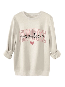 Detailed view of FAVORITE auntie pink typography on a warm cream-colored crewneck sweatshirt