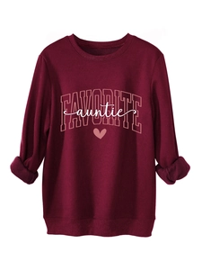 Detail of burgundy pullover sweatshirt featuring Favorite Auntie print and heart graphic