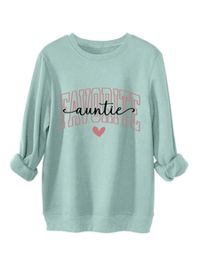Detail of mint green sweatshirt featuring pink Favorite Auntie print and ribbed cuffs