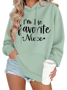 Detail of mint green hoodie featuring the favorite niece text print and soft fabric