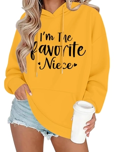 Detail of yellow oversized hoodie featuring I'm The Favorite Niece text and kangaroo pocket