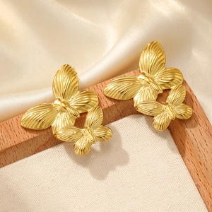 Elegant gold butterfly earrings in stainless steel with textured wings and 3D design