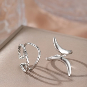Silver minimalist earring set with layered twist texture and fluid asymmetrical design