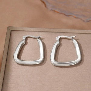 Minimalist U-shaped stainless steel earrings with a polished silver-tone square design