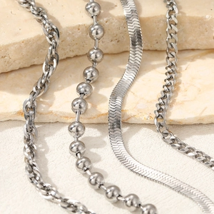 Set of four silver stainless steel layered chains including cuban and snake bone styles