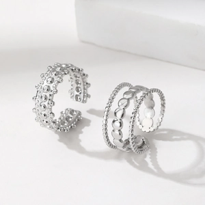 Irregular stainless steel ring set with studded band and layered beaded chain design