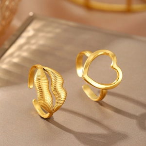 Minimalist gold adjustable stainless steel ring featuring textured lips and open heart design