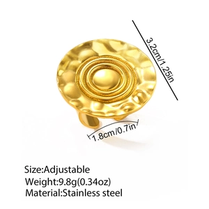 Detail of golden stainless steel adjustable ring with hammered texture and 3.2cm round face