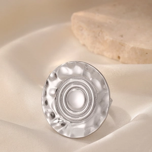 Minimalist silver 316 stainless steel ring with hammered texture and geometric circular design