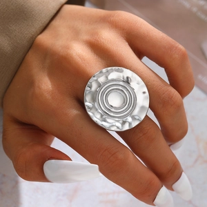 Macro shot of large 316 stainless steel ring featuring a hammered texture and irregular design