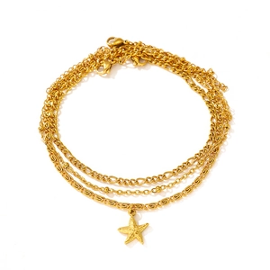 Three-layer gold starfish anklet set featuring figaro, bead, and rectangle clip chains