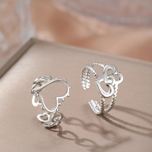 Minimalist silver-toned stainless steel heart ring set with textured beaded open design