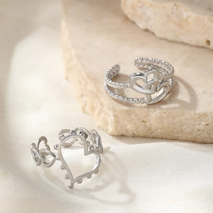 Minimalist silver heart-shaped adjustable rings in hollow and twisted rope design
