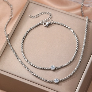Minimalist stainless steel jewelry set with sparkling round solitaire pendant and box chain