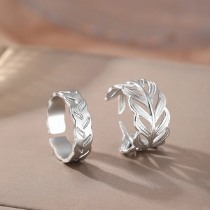 Silver stainless steel leaf ring set with textured and hollow foliage patterns