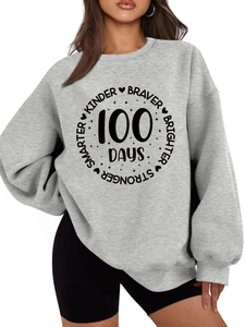 Detail of grey fleece sweatshirt with 100 Days smarter kinder braver printed graphic
