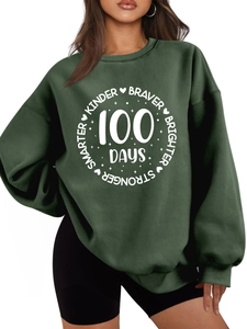Detail of dark green thick sweatshirt with white Kinder Braver 100 Days round print