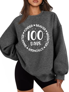 Detail of charcoal grey sweatshirt featuring 100 days inspirational white printed graphics