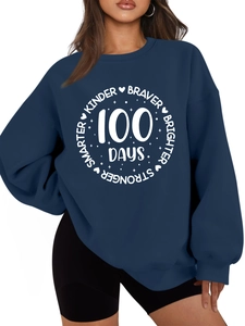 Close-up of Navy Blue sweatshirt featuring Kinder Braver 100 Days motivational print