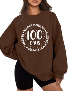 Detail view of brown crewneck sweatshirt with 100 Days smarter kinder braver print