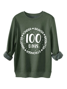 Detail of forest green sweatshirt showing warm gray fleece lining and ribbed cuffs