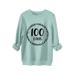Mint green kids sweatshirt with Kinder Braver 100 Days print and ribbed cuffs
