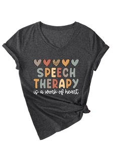 Detail view of charcoal V-neck tee with heart prints and Speech Therapy lettering