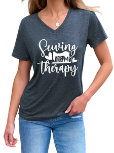 Detail of V-neck grey marl T-shirt featuring Sewing is my therapy graphic and texture