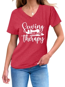 Close-up of red V-neck T-shirt with white Sewing Is My Therapy graphic and sewing machine print